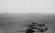 Asisbiz 4FG Spitfires XRI and MDE and their crews during the arrival of the first P 47 Thunderbolt at Debden 01