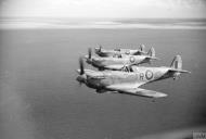 Asisbiz Spitfire LFVb RAF 244 Wing IRG AB502 over the Tunisian coast IWM CNA818