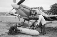 Asisbiz Spitfire external fuel tank filled with beer for Allied forces in Normandy 1944 01