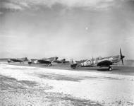 Asisbiz Spitfire MkIXe RCAF 412Sqn VZW taxing at B108 Rheine Germany 1945 IWM MH6849