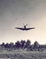 Asisbiz Spitfire MkVII c wing landing at a base in Italy 02