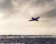 Asisbiz Spitfire MkVII c wing taking off at a base in Italy 01