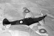 Asisbiz Factory fresh Spitfire MkIa P9450 showing upper wing camouflage in flight April 1940 web 01