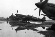 Asisbiz Spitfires MkIX RAF 329Sqn 5AS at Cigognes Holland 1945 web 01