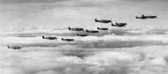 Asisbiz Spitfire MkVb USAAF 67TRG12TRS in formation over England 03