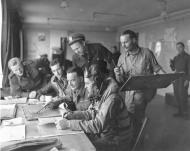 Asisbiz VCS 7 pilots and English personnel in the ready room of their English base awaiting orders to fly over to France 1944 80 G 302115