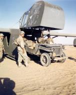 Asisbiz WWII USAAF color photo of Airborne Infantryman loading a Jeep into a Waco CG 4A Glider Sicily 01