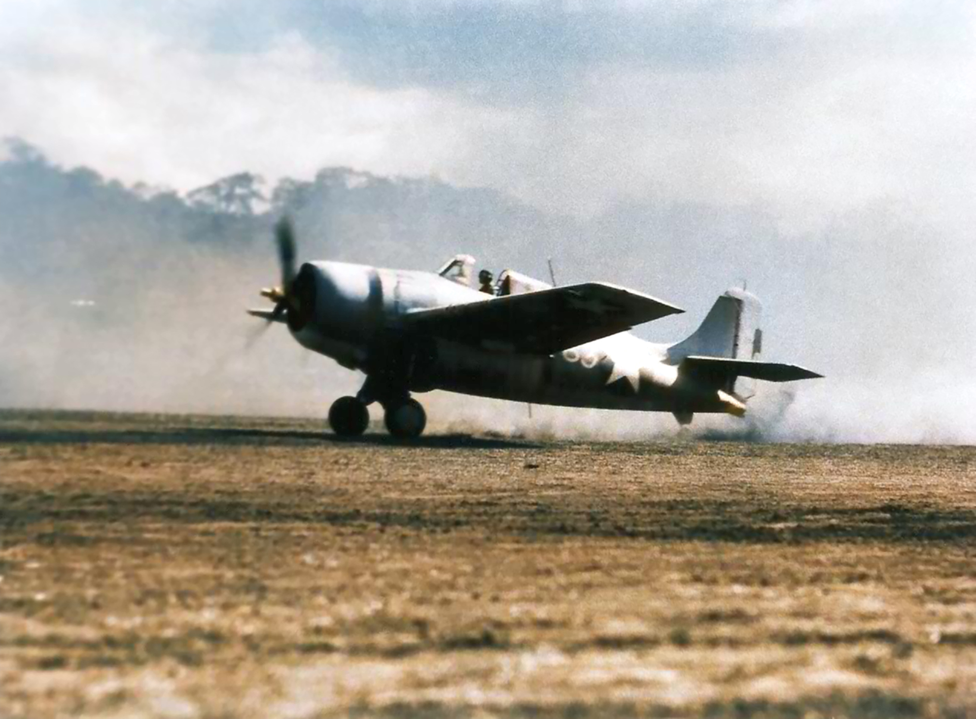 Grumman F4F-3 Wildcat MAG 23 (Marine Aircraft Group 23) blowing dust every where as it begins to take off Guadalcanal 1943 01