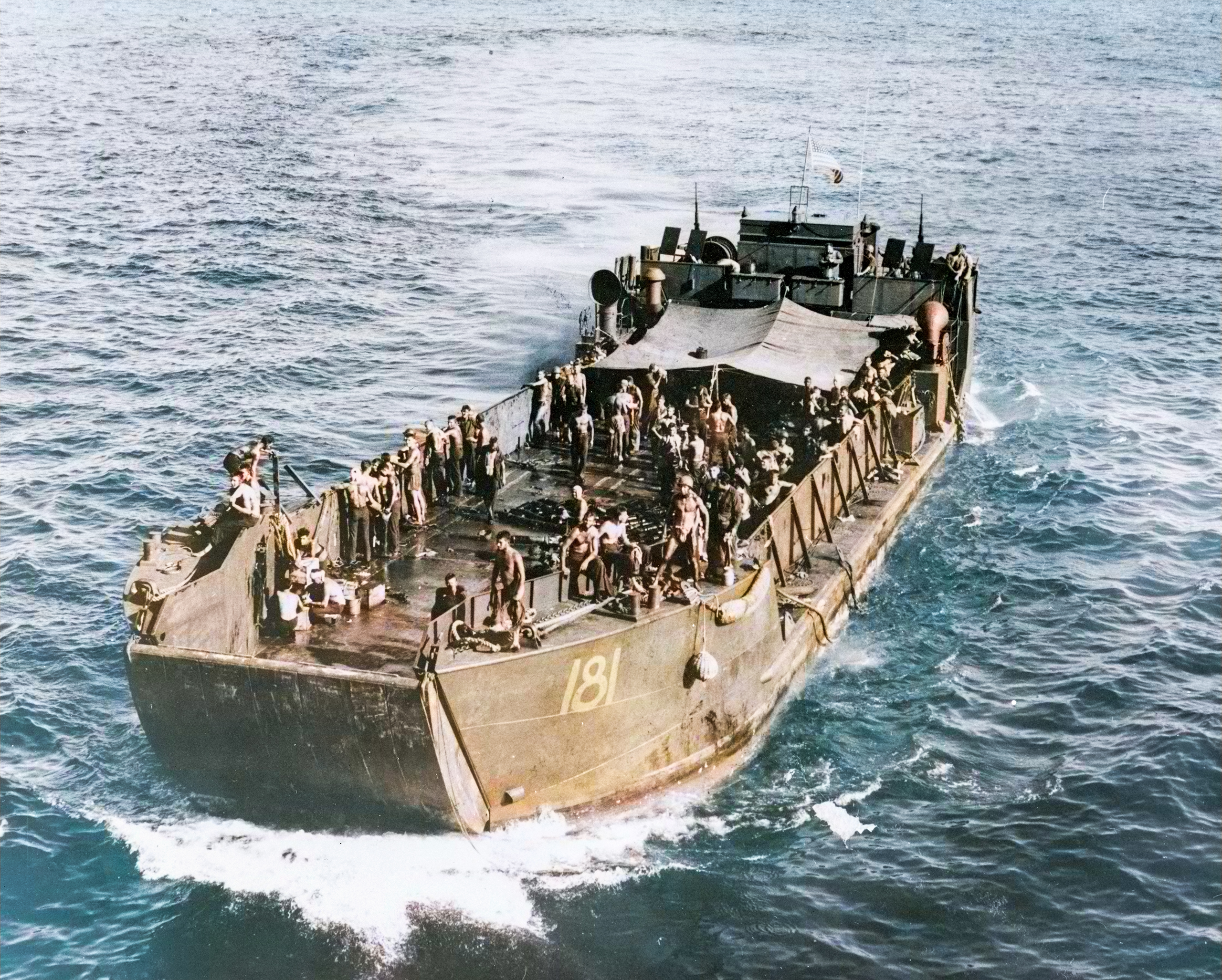 USS LCT 181 near USS Fletcher (DD 445) with USS DeHaven (DD 469) crew sunk by Jap air attack off Guadalcanal 1st Feb 1943 80-G-284581