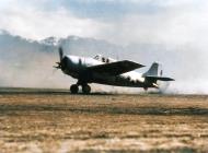 Asisbiz Grumman F4F 3 Wildcat MAG 23 (Marine Aircraft Group 23) blowing dust every where as it begins to take off Guadalcanal 1943 01