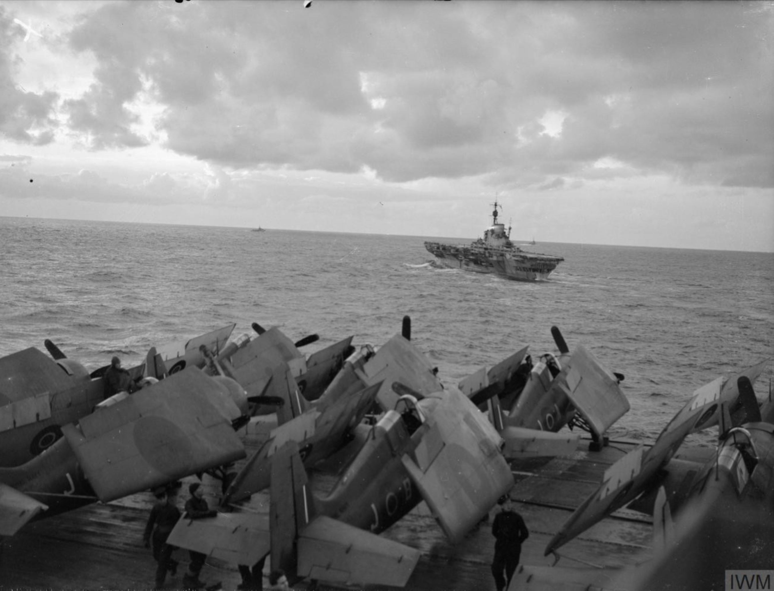 Fleet Air Arm Martlets aboard HMS Trumpeter with HMS Implacable foreground Dec 1944 IWM A26803