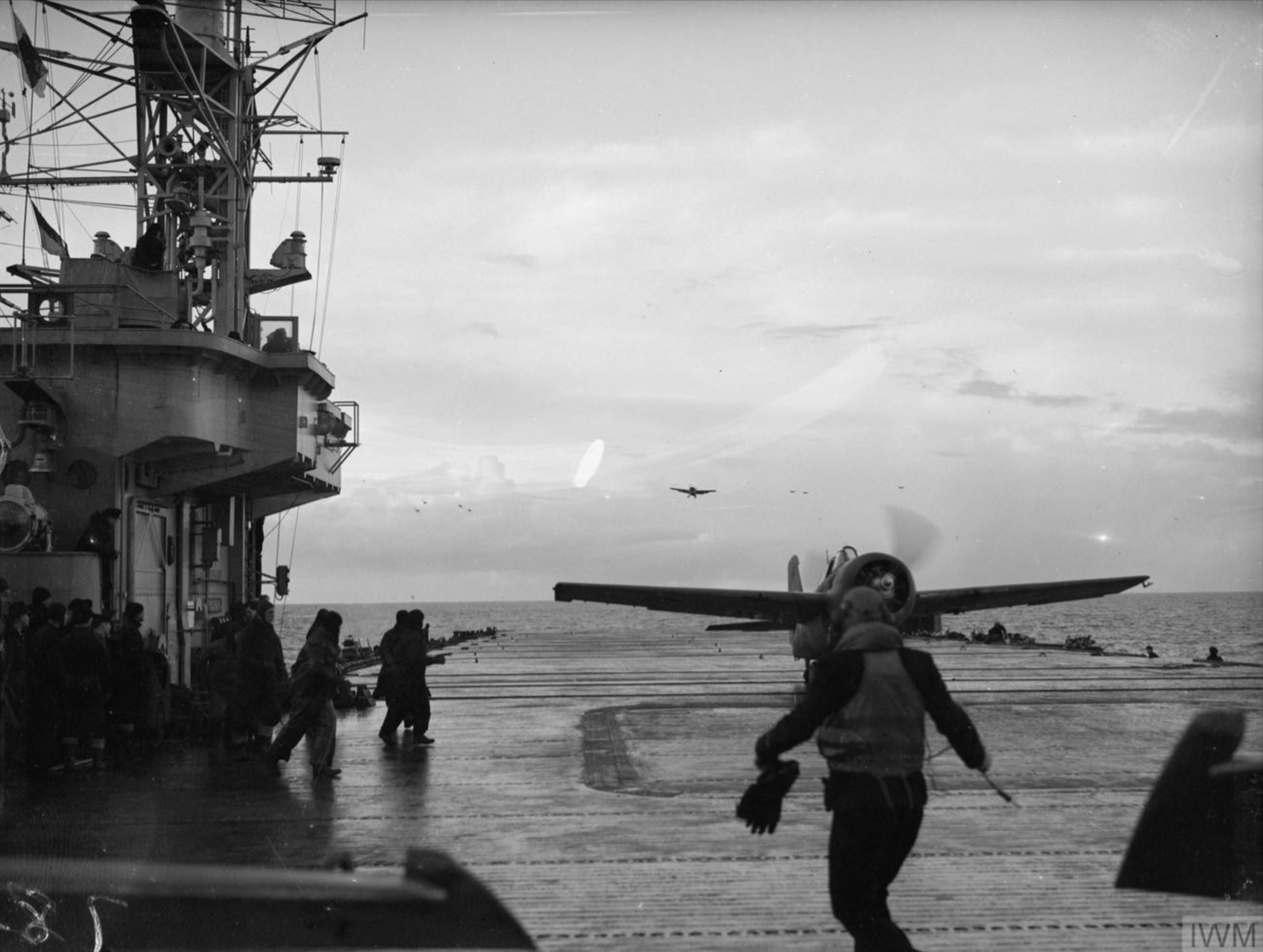 Fleet Air Arm Martlets aboard HMS Trumpeter with HMS Implacable foreground Dec 1944 IWM A26806