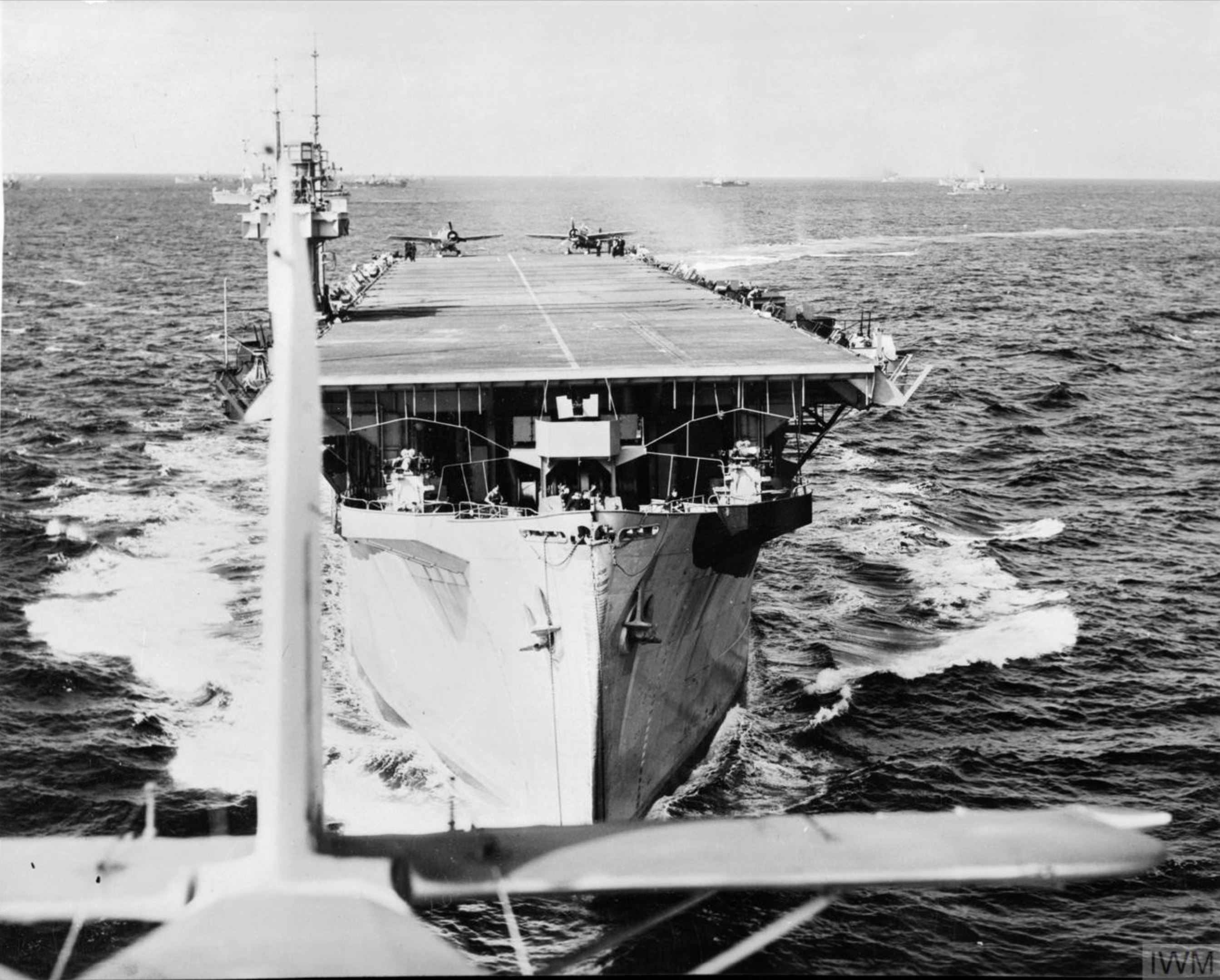 HMS Biter photographed from one of her Fairey Swordfish planes just after taking off IWM A22715