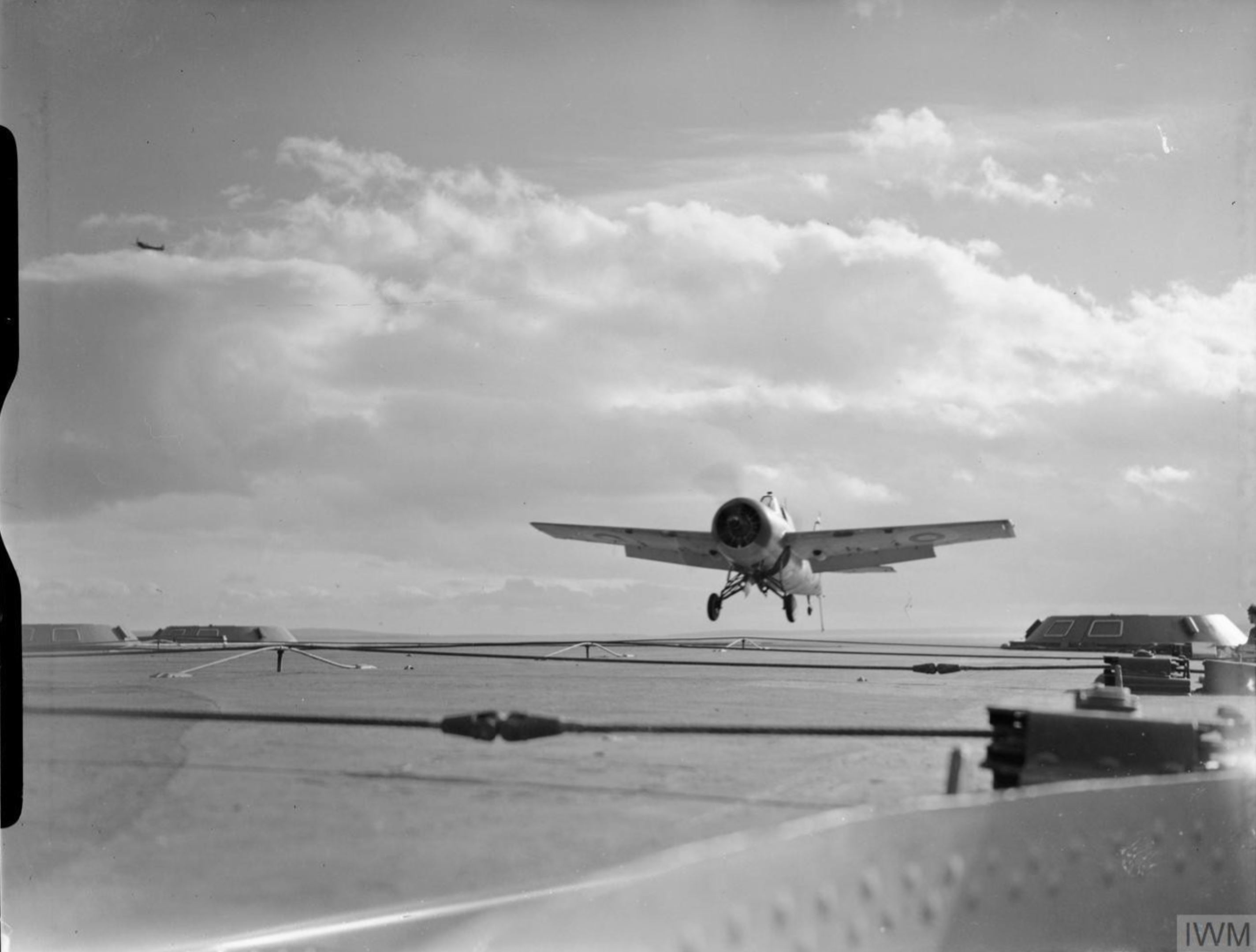 Fleet Air Arm Martlet MkIII FAA 882NAS landing aboard HMS Victorious IWM A12543