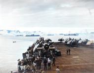 Asisbiz USS Sargent Bay (CVE 83) in Kerama Retto anchorage spread an anti kamikaze smoke screen 3rd May 1945 80 G 342629