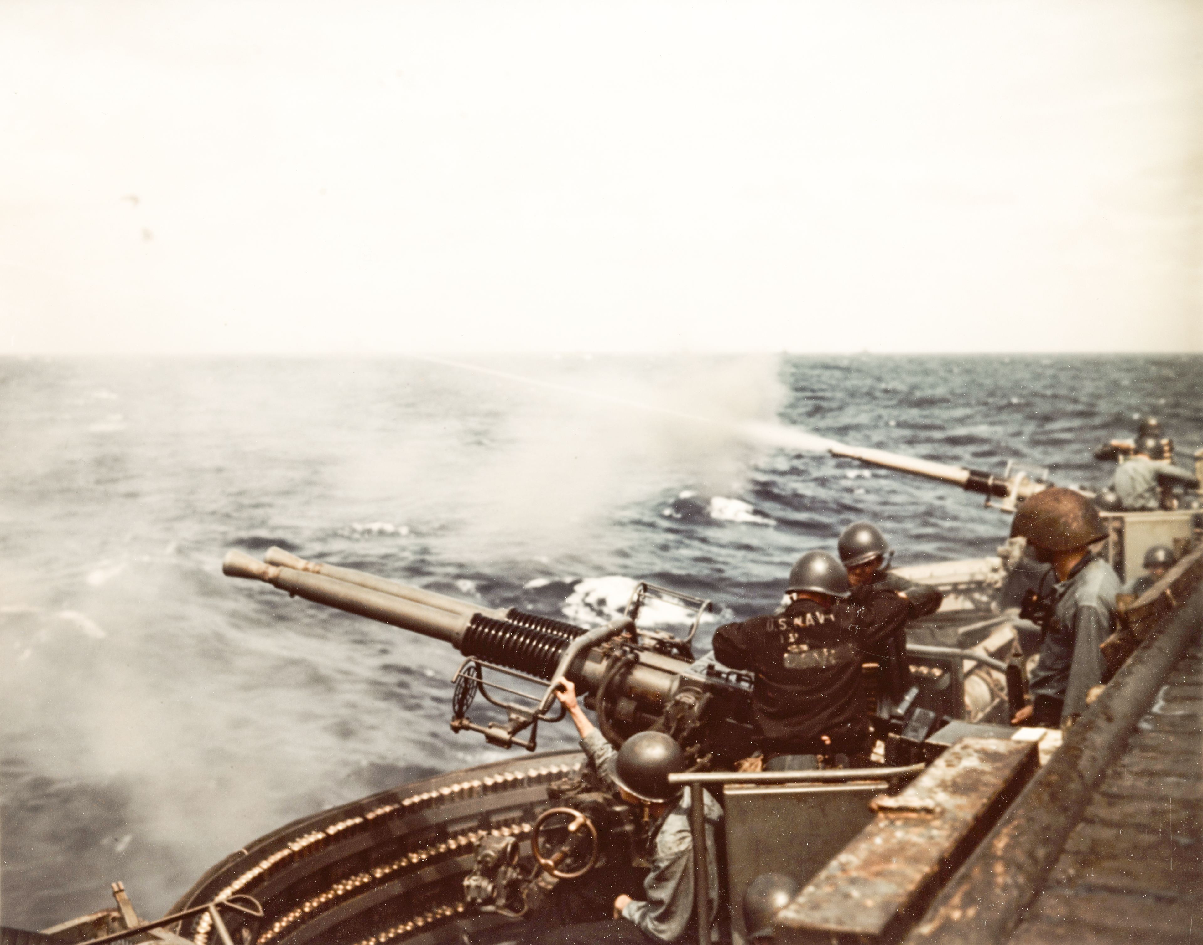 USS Makin Island (CVE-93) 40mm twin gun mounts firing during gunnery practice 21st Mar 1945 80-G-K 5171