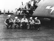 Asisbiz USS Makin Island (CVE 93) with members of the ship's photographic complement NH 95044