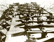 Asisbiz USN VF 71 Grumman F4F 4 Wildcats 71F19 and Spitfires aboard USS Wasp CV7 off Malta Apr 1942