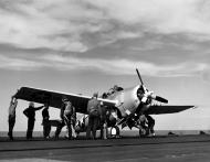 Asisbiz General Motors FM 2 Wildcat Black 22 in late war color scheme being prepared for launch 01