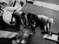 Asisbiz General Motors FM 2 Wildcat being rearmed aboard CVE 9 USS Mission Bay 3rd Jan 1944 01