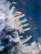 Asisbiz Boeing B 29 Superfortresses 20AF drop incendiary bombs on buildings of the city that are burning below Kobe Japan 4th June 1945 01