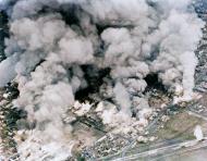 Asisbiz USN Carrier bombing raids show large clouds of smoke rising from burning buildings in Kushiro Japan July 1945 01