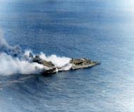 Asisbiz USS Franklin (CV 13) dead in the water after she was hit by a Japanese air attack off Japan 19th Mar 1945 80 G 373734