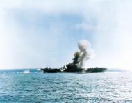 Asisbiz USS Essex (CV 9) being hit by a Japanese Judy during Kamikaze attacks off Luzon 25th Nov 1944 80 G 270740