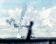 Asisbiz USS Kitkun Bay (CVE 71) during an attack by Japanese kamikaze which crashes astern 18th June 1944 80 G 243432