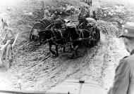 Asisbiz Operation Weserubung German horse drawn supply wagons transiting a muddy road on the Murmansk front NH 71357