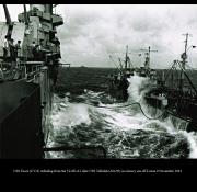 CV 9 USS Essex and T2 SE A1 oiler USS Tallulah AO 50 refueling in heavy seas off Luzon 9 Nov 1944