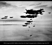 TBM Avengers and SB2C Helldivers from Essex Air Group 83 dropping bombs on Hakodate Japan July 1945