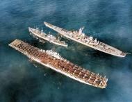 Asisbiz USS Antietam (CV 36) and USS Wisconsin (BB 64) alongside USS Rainier (AE 5) in Korean waters 8th Feb 1952 80 G 440189