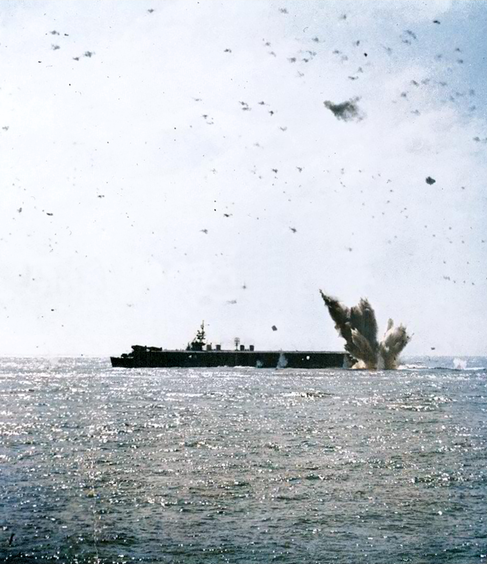 USS Bataan (CVL 29) under attack by a Japanese Judy which dropped a 500lb bomb off Okinawa on 20th March 1945 01