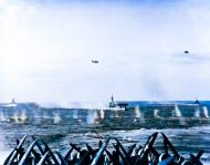 Asisbiz Japanese Navy Yokosuka D4Y3 Judy bomber passes near USS Bataan (CVL 29) off Japan on 20th Mar 1945 80 G 319232