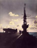 Asisbiz USS Bogue (CVE 9) at sunset 1945 01