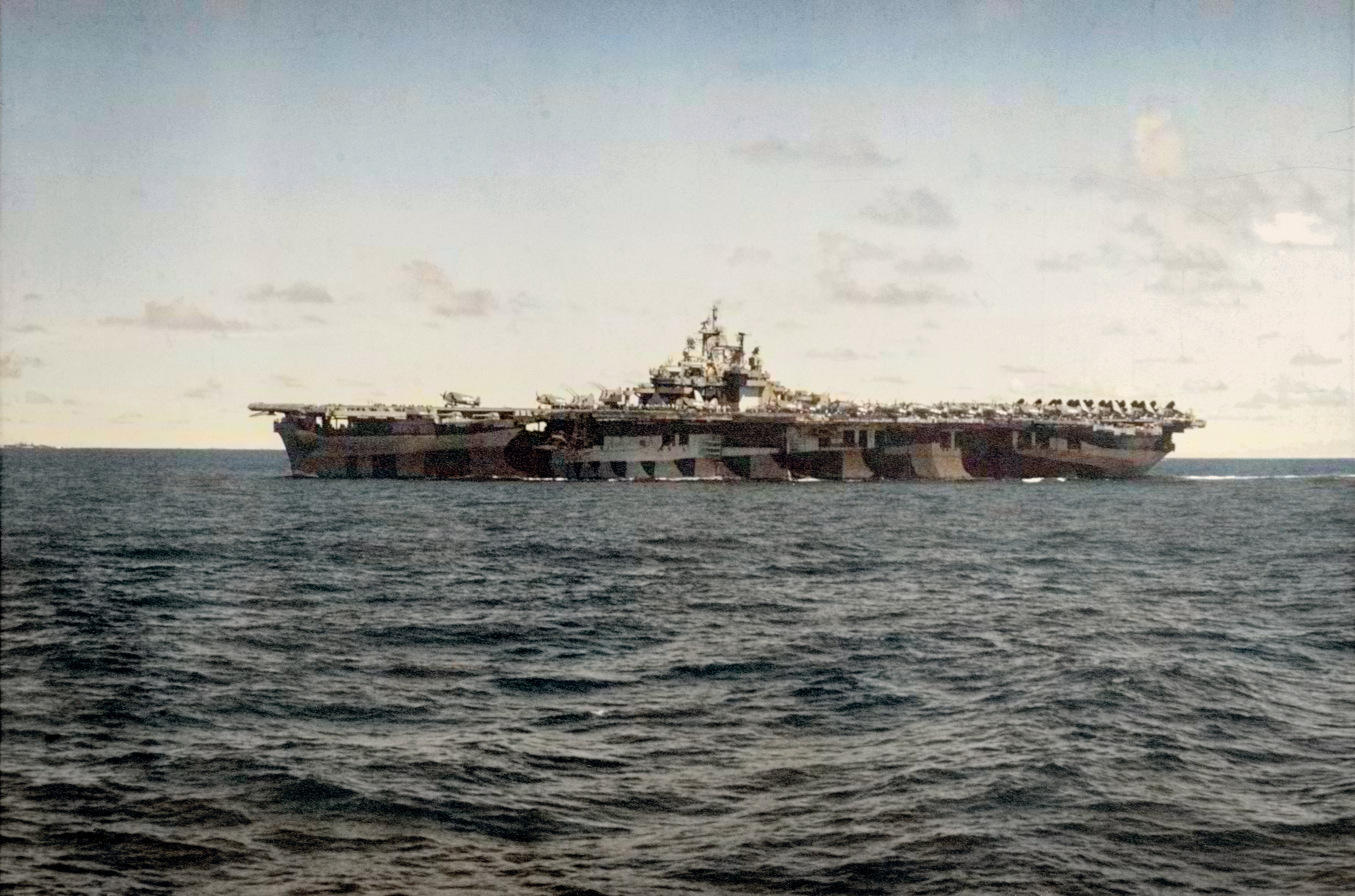 Asisbiz USS Bunker Hill (CV-17) at sea while participating in strikes on the Palau Islands 27th Mar 1944 80 G K 1560