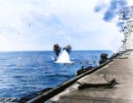 Asisbiz USS Bunker Hill (CV 17) after a near miss by Japanese air attack 19th June 1944 NH 74281