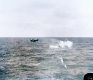 Asisbiz USS Core (CVE 13) Grumman TBF Avenger drops bombs at a towed target North Atlantic April 1944 80 G 269026