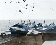 Asisbiz Grumman F6F 5 Hellcat smashes into 6 other Hellcats parked forward on Cowpens' flight deck Jan 1945 01
