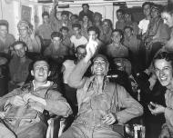 Asisbiz Pilots in the ready room celebrating when Japan's surrender came over the intercom August 1945