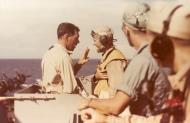 Asisbiz USS Cowpens (CVL 25) Comdr Hugh R Nieman JR (left center) gives instructions to VC 25 skipper late 1943 80 G K 13724