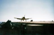 Asisbiz USS Cowpens (CVL 25) Grumman F6F 3 Hellcat VF 25 landing aboard late 1943 80 G K 1077