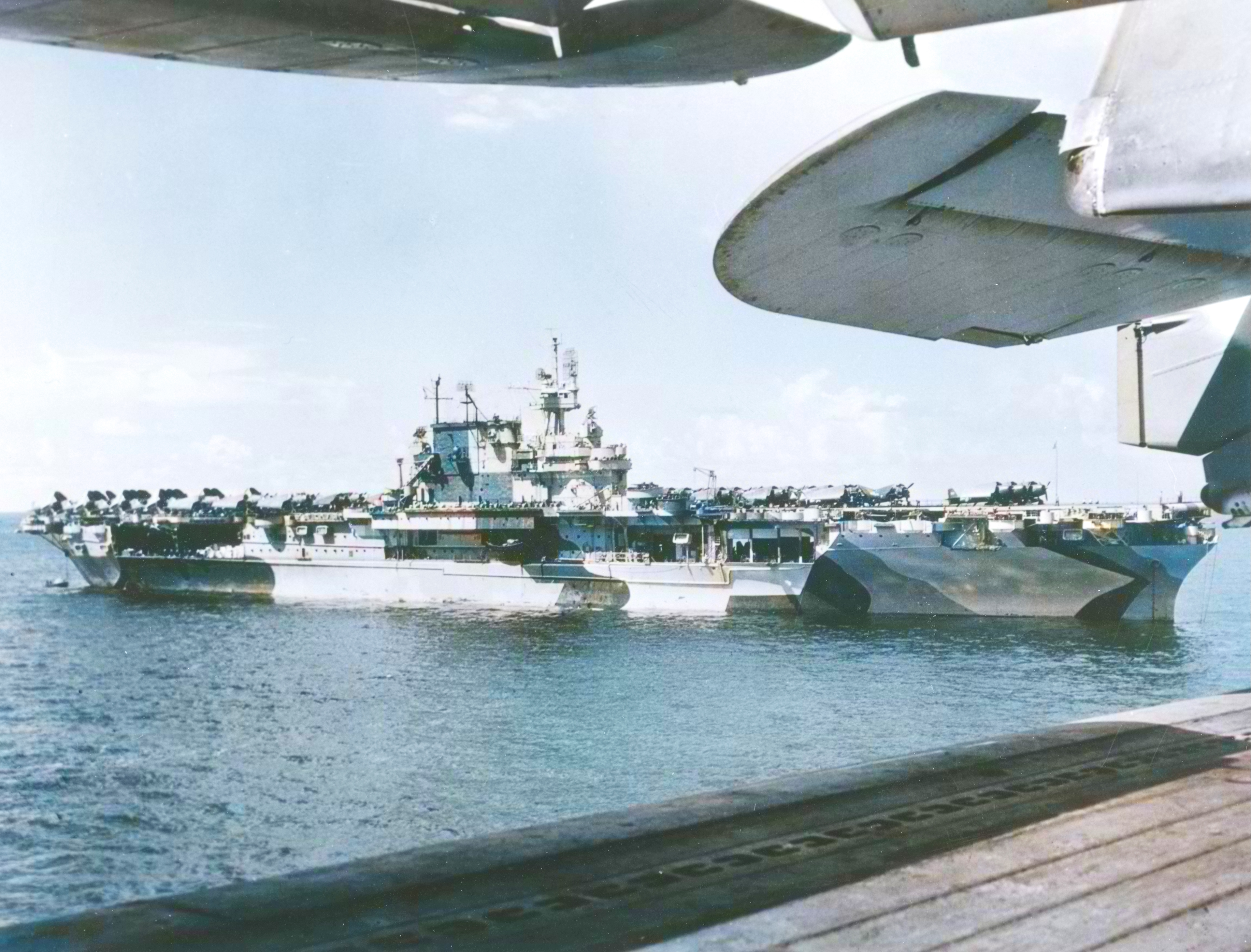 Asisbiz USS Enterprise (CV-6) anchored off Saipan while painted in camouflage Measure 33 Design 4Ab mid 1944 NH 97266