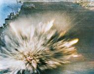 Asisbiz A Japanese bomb exploding on the flight deck of USS Enterprise (CV 6) Battle of the Eastern Solomons 24th Aug 1942 80 G 17489
