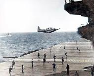 Asisbiz Douglas SBD 3 Dauntless drops message over USS Enterprise (CV 6), 18 May 1942