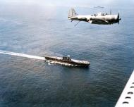 Asisbiz Douglas SBD 3 Dauntless flies over USS Enterprise (CV 6) and USS Saratoga (CV 3) on 19th Dec 1942