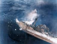Asisbiz Japanese Cargo Ship possibly Nitcho Maru was hit by aircraft from USS Enterprise (CV 6) Saipan 12th Jun 1944 NH 95568