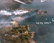 Asisbiz Japanese facilities in Yap City Yap Island burning after being hit by Task Force 58 planes 30th Mar 1944 80 G 250391