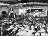 Asisbiz Returning veterans in the hangar of the USS Enterprise (CV 6) in Pearl Harbor Aug 1945 80 G 495657